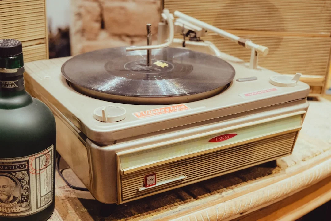 Vintage record player with a bottle of rum.